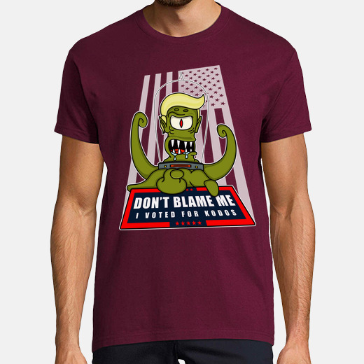 A white t-shirt from Tostadora featuring the phrase 'Don't blame me, I voted for Kodos' in a bold, dark font.