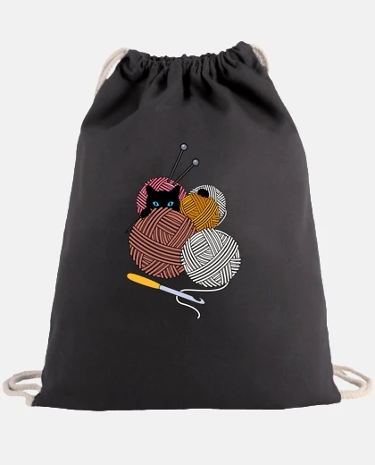 Bag cat and balls of wool