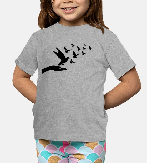 Kids flying pigeons in a hand silhouette