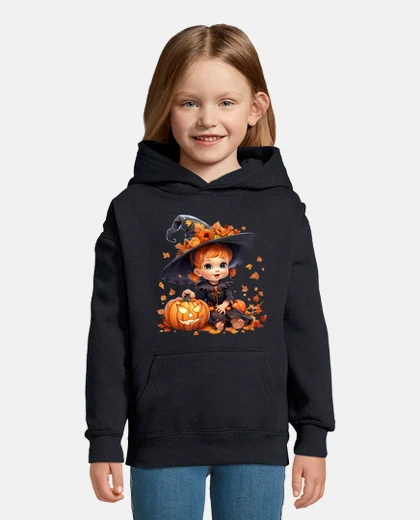 Children's halloween witch girl and pumpkins