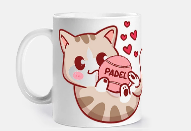 Cup kitten with padel tennis ball