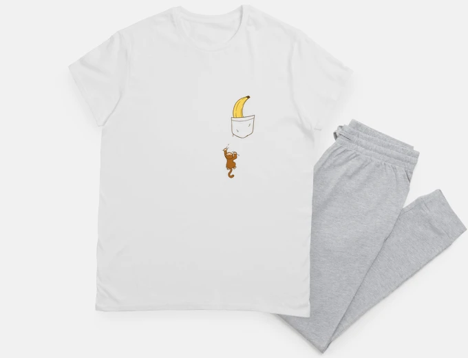Pigiama scimmia che vuole prendere una banana in tasca.